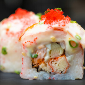 Red Dragon Roll sushi topped with ebiko and mayo, served at Sushi Yaki Uttara in Dhaka
