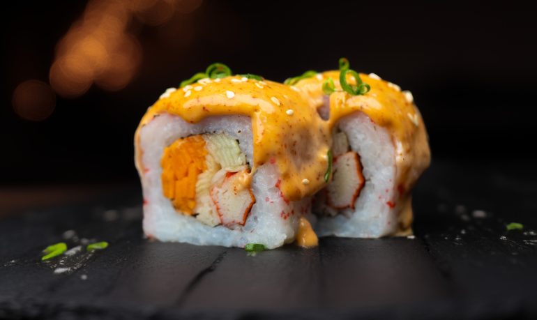 Lava Roll sushi with salmon, ebiko, mayo, crab stick, carrot, and cucumber at Sushi Yaki Uttara