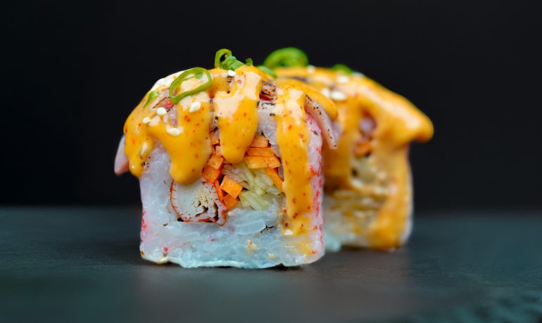 Pink Sakura sushi with tuna, crab sticks, cucumber, carrot, ebiko, and mayo served at Sushi Yaki Uttara